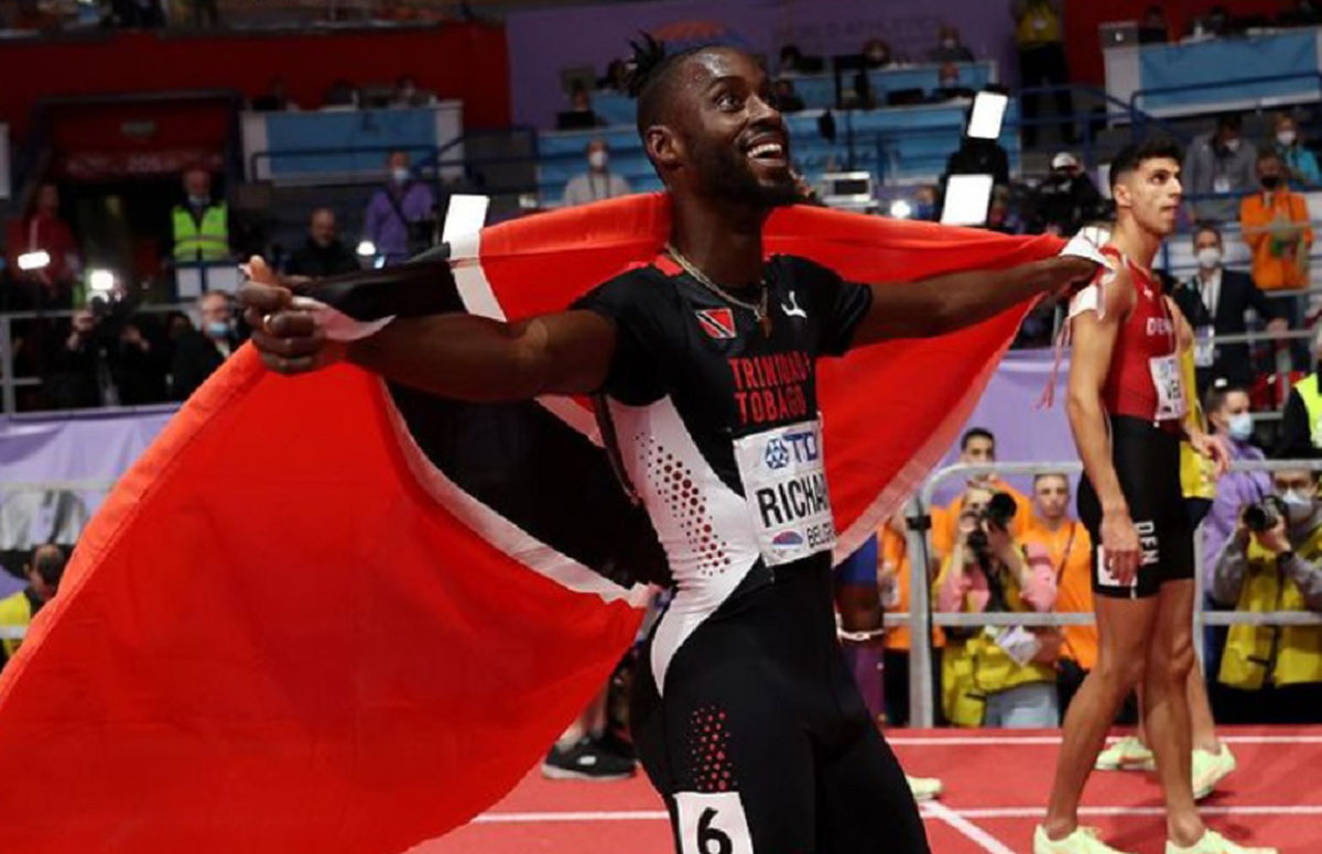 Jereem Richards 400m World Indoor Championship with flag